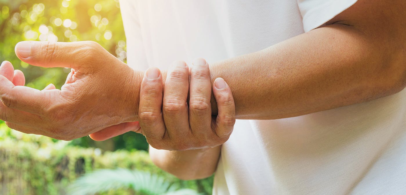 Hands of Male Patient is Doing Palm or Wrist Exercise with Spring