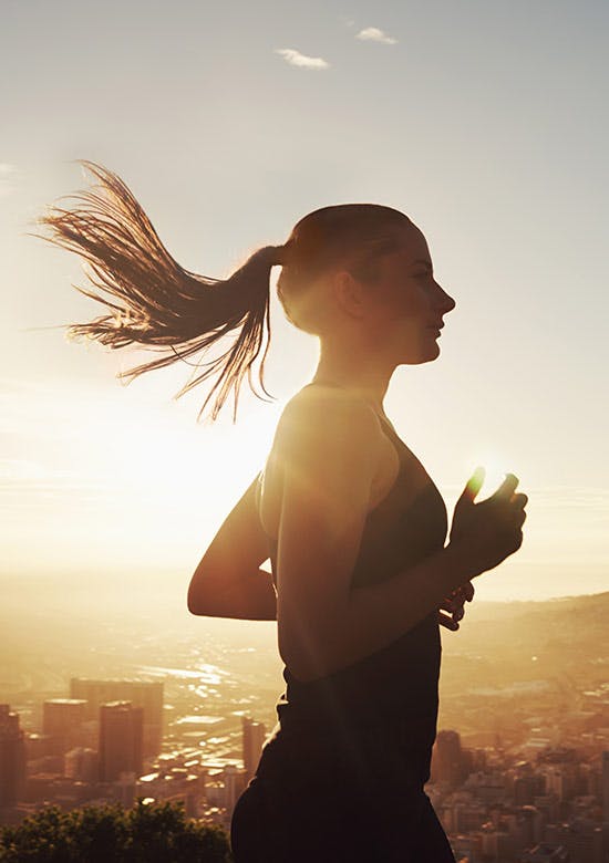 Discover the joy of movement Side picture of young woman running