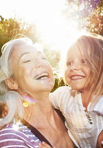 A simling old woman and her granddaughter