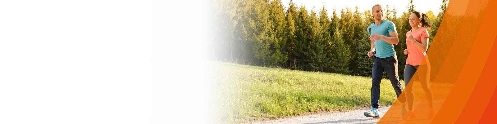 A young couple jogging in the park - learn the benefits of exercise