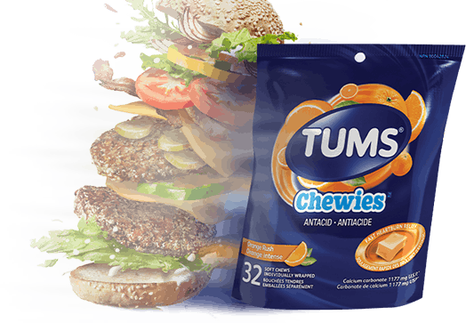 Double stacked cheeseburger next to a bag of TUMS Chewies