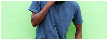 Young man wearing a baggy blue t-shirt