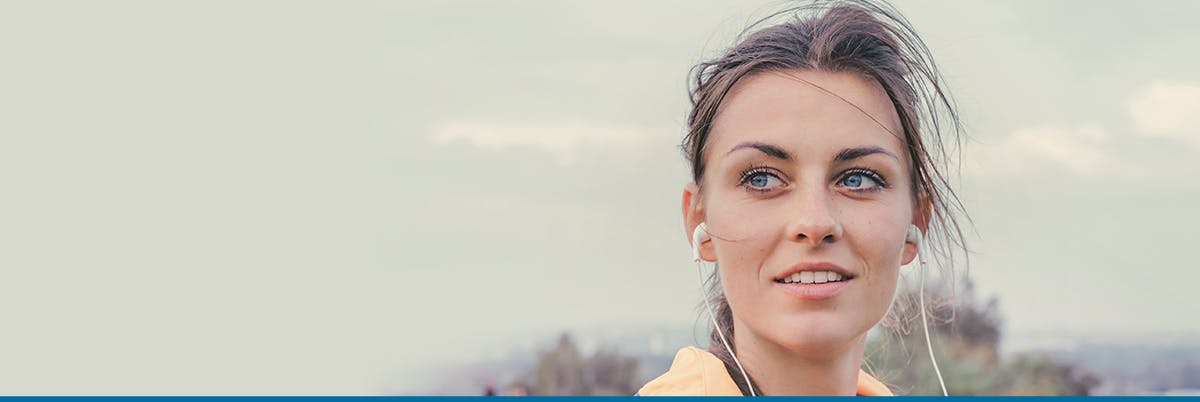 Woman running with headphones in her ears